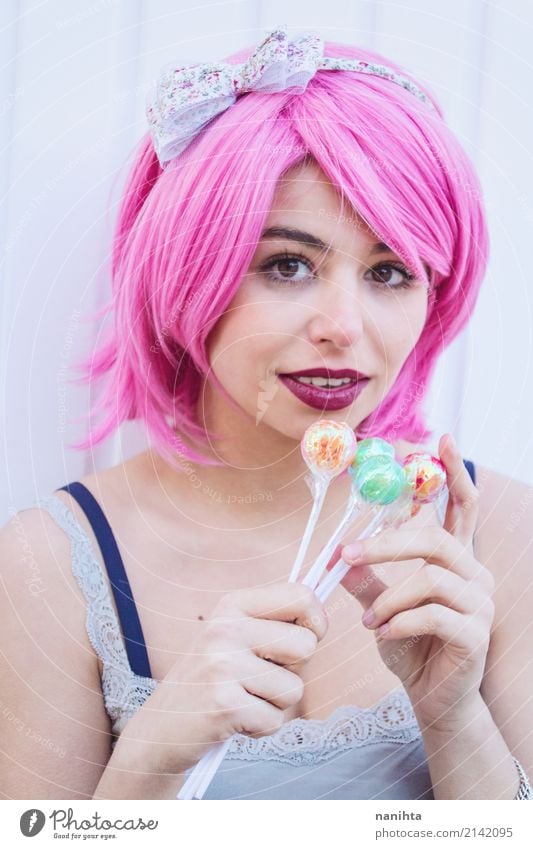 Young woman with pink hair is holding colorful lollipops Candy Lollipop Style Beautiful Human being Feminine Youth (Young adults) 1 18 - 30 years Adults