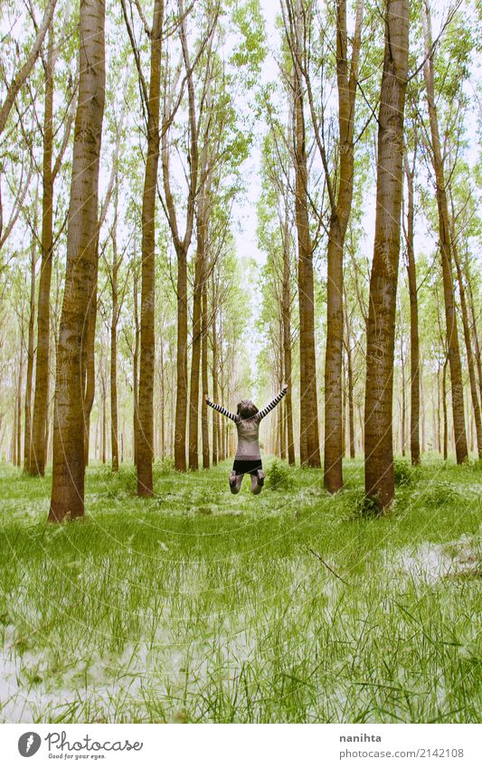 Young woman jumping in the middle of a forest Wellness Life Vacation & Travel Adventure Far-off places Freedom Expedition Human being Feminine