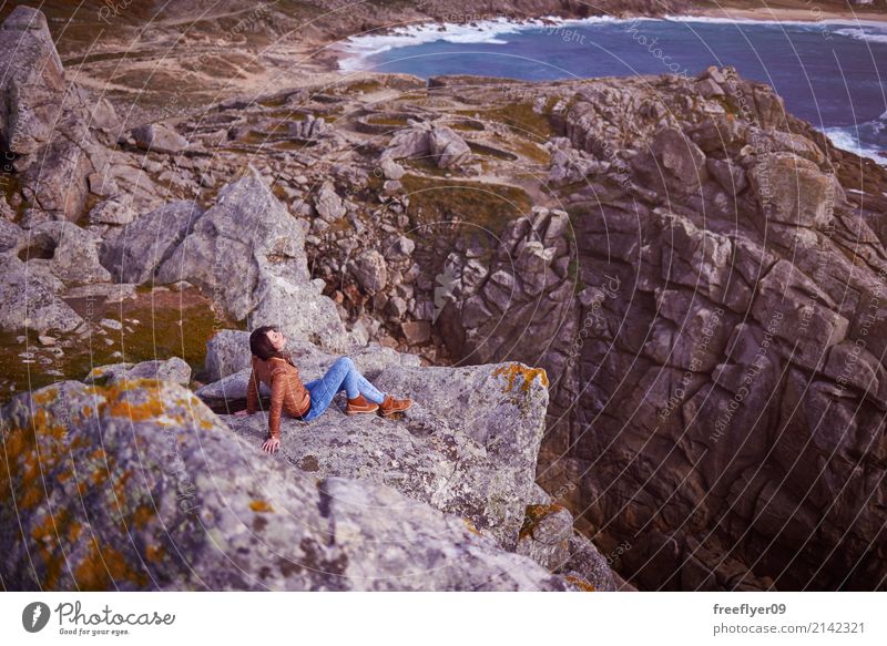 Young woman over a cliff in a celtic ruins in Galicia Vacation & Travel Tourism Adventure Freedom Winter Mountain Hiking Human being Youth (Young adults) 1