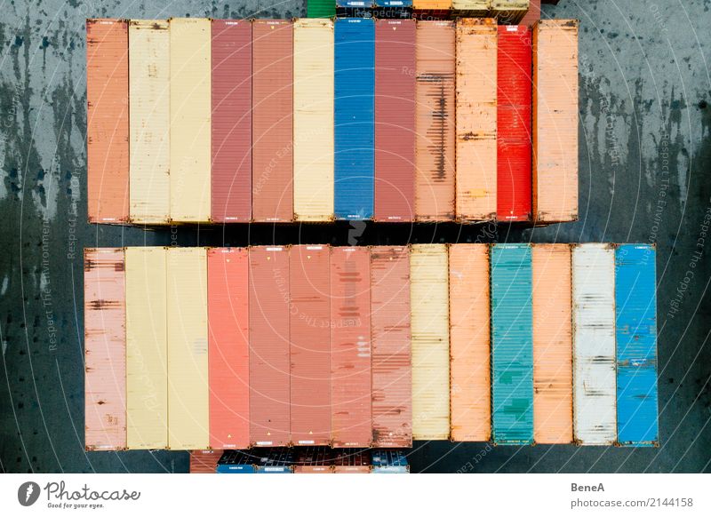 Colorful cargo container in a goods warehouse Workplace Factory Economy Industry Trade Logistics Business Company Transport Truck Container ship Harbour