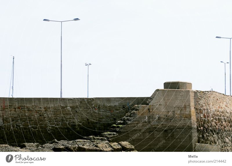 low tide Vacation & Travel Fishing village Deserted Harbour Mole Wall (barrier) Wall (building) Lamp Lantern Mast Firm Loneliness Stagnating Environment Time