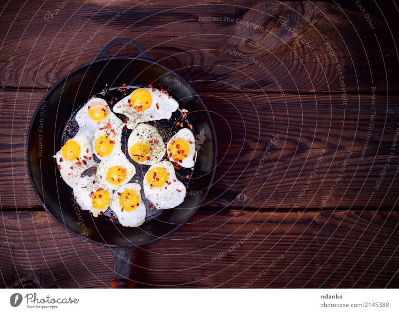 Fried quail eggs Herbs and spices Nutrition Breakfast Pan Kitchen Wood Delicious Natural Red Egg Yolk Protein frying pan Frying food cook pepper empty space