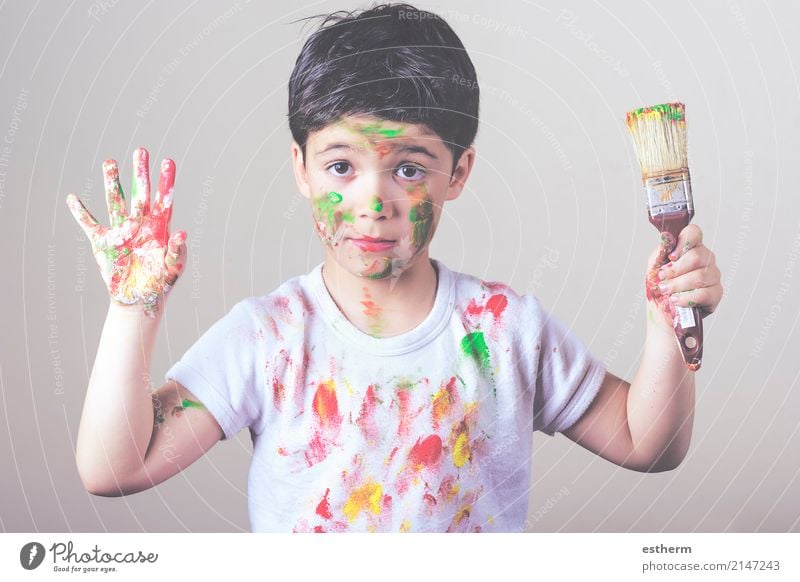 boy with painted face and T-shirt painting Lifestyle Joy Playing Children's game Human being Masculine Toddler Boy (child) Infancy 1 3 - 8 years Artist Painter