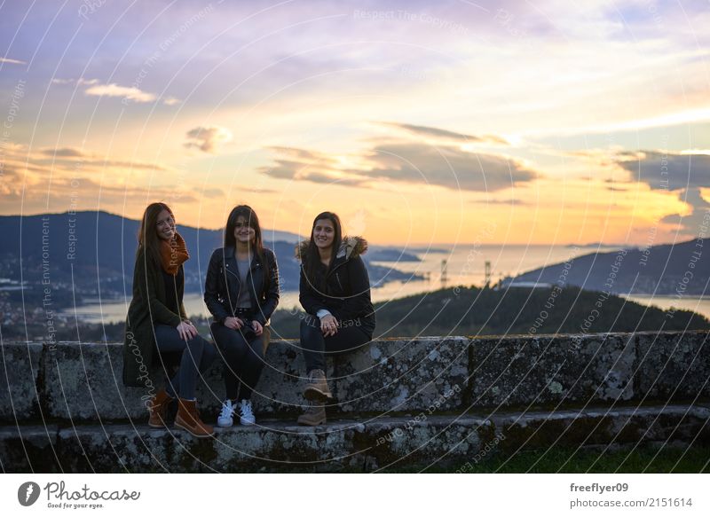 Three young woman posing at sunset Vacation & Travel Tourism Trip Freedom Hiking Human being Feminine Young woman Youth (Young adults) 3 18 - 30 years Adults