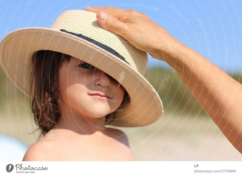 hand on hat Parenting Education Kindergarten Human being Child Baby Toddler Parents Adults Brothers and sisters Grandparents Senior citizen Family & Relations