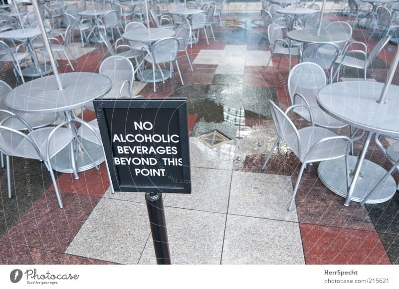 non-drinker zone Alcoholic drinks Chair Table Restaurant Wet Gloomy Gray Red Café Sidewalk café Prohibition sign Bans Closed Water puddle Puddle Colour photo