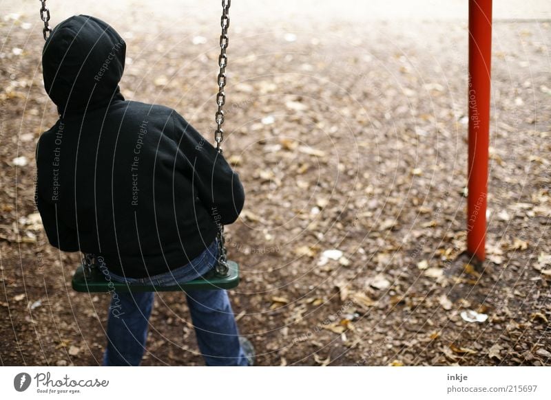 no one to play with... Playing Children's game Swing Playground Earth Autumn Park Jeans Hooded sweater Observe Think To swing Looking Sit Dream Sadness Wait