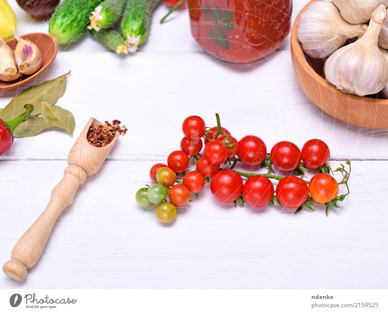 Red cherry tomatoes Vegetable Herbs and spices Juice Bowl Spoon Wood White Tomato food background Garlic cucumber Salad Vitamin Tasty healthy bunch ripe Cherry