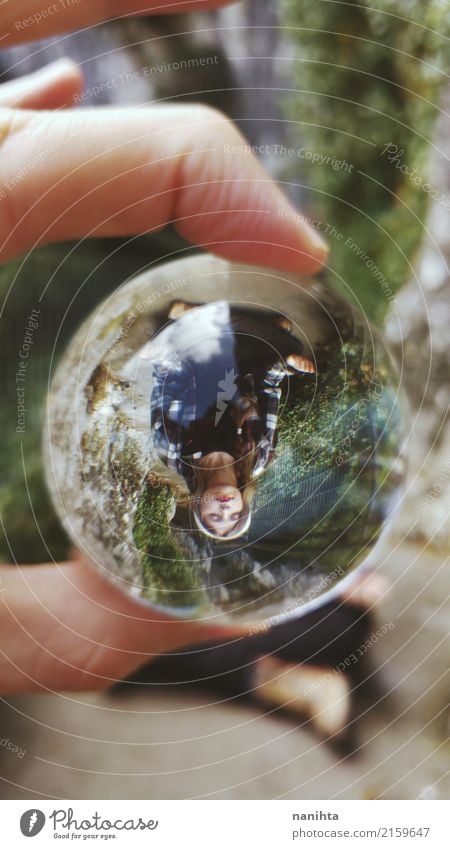 Young woman meditating viewed through a crystal ball Lifestyle Healthy Harmonious Well-being Relaxation Meditation Adventure Freedom Expedition Human being
