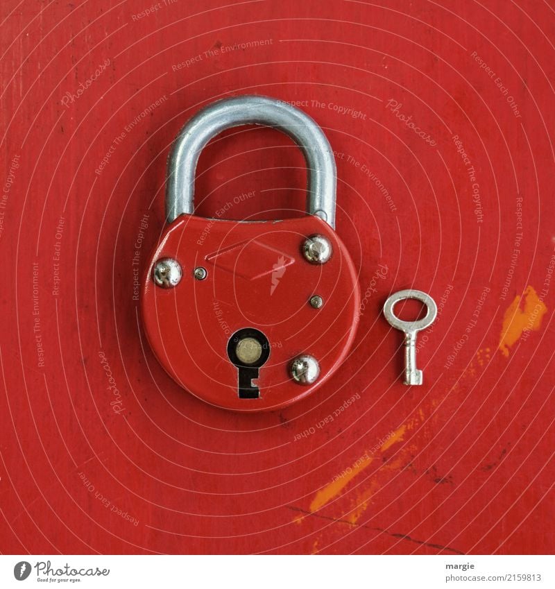 Big red lock with much too small key Living or residing Tool Technology Red Safety Key Padlock Door lock Size comparison Small Large Undo Close Security force