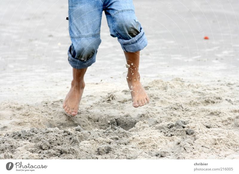 Holidays at last! Freedom Beach Child Legs Feet Barefoot 1 Human being Environment Sand Summer Coast knee sand Jeans Jump Romp Blue Joie de vivre (Vitality)