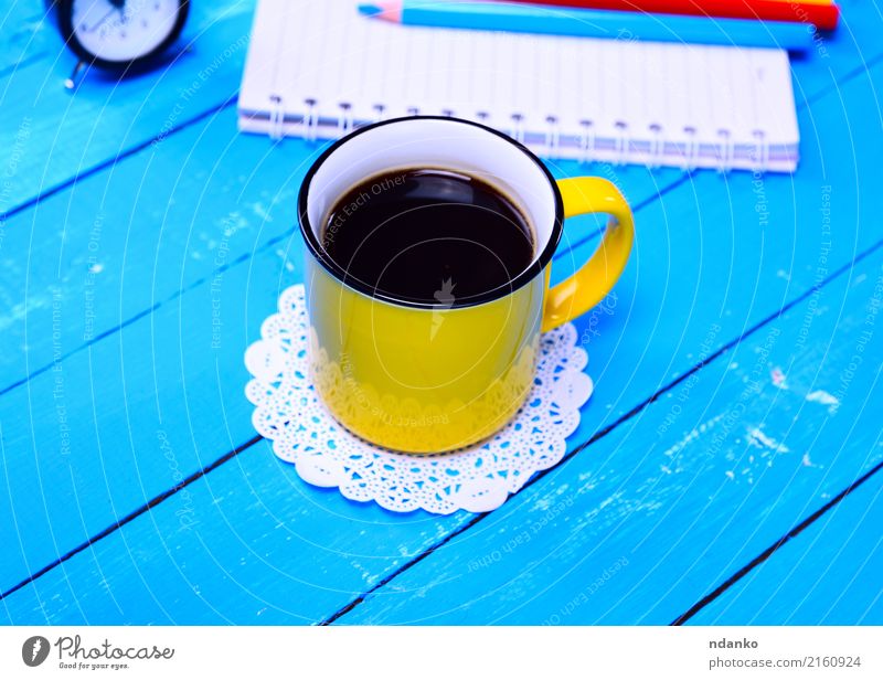 Black coffee in a yellow mug Breakfast To have a coffee Beverage Coffee Espresso Cup Table Restaurant Wood Fresh Hot Above Retro Yellow Café drink Fragrant Top