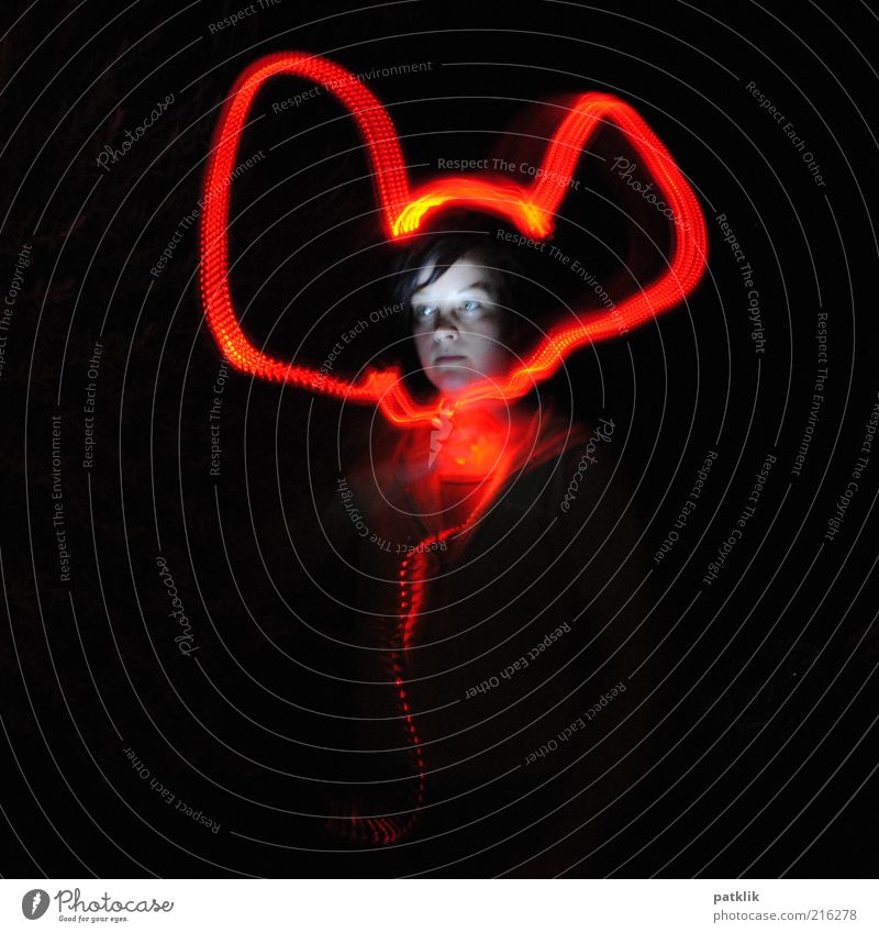 Mickey Mouse Young woman Youth (Young adults) Face 18 - 30 years Adults Movement Long exposure Red light Experimental Ear Colour photo Exterior shot Night