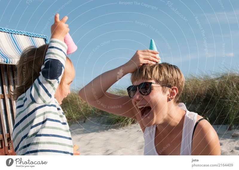 Child fooling around with woman on the beach Playing Vacation & Travel Trip Summer Summer vacation Parenting Toddler Young woman Youth (Young adults) Mother