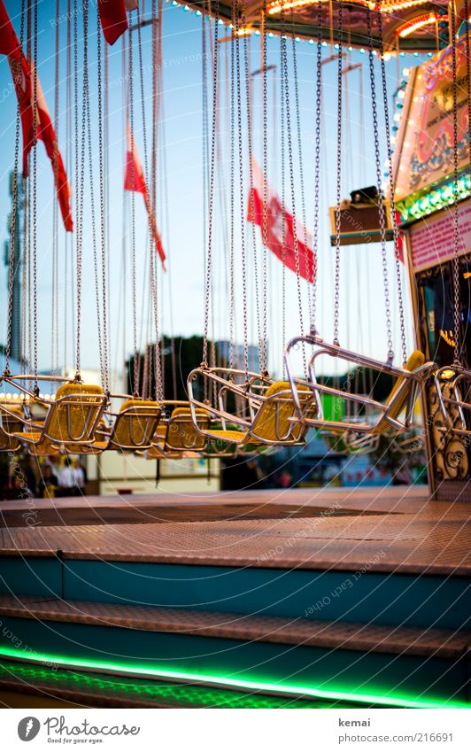 Riding the chain Leisure and hobbies Chairoplane Carousel Trip Feasts & Celebrations Fairs & Carnivals Cannstatter Wasen Chain Seat Lighting Driving Hang
