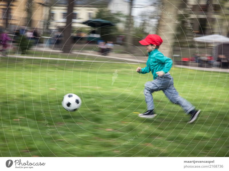 Little boy and football Athletic Leisure and hobbies Playing Sports Foot ball Human being Masculine Child Boy (child) Infancy Life 1 3 - 8 years Park Meadow