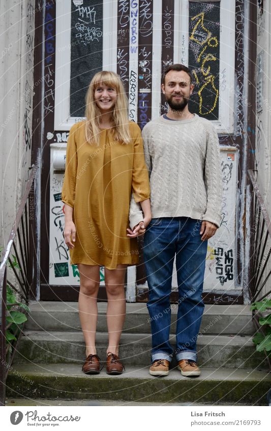 young couple - standing on stairs - hiphip Young woman Youth (Young adults) Young man Couple Partner 18 - 30 years Adults Stairs Front door Jeans Dress Sweater