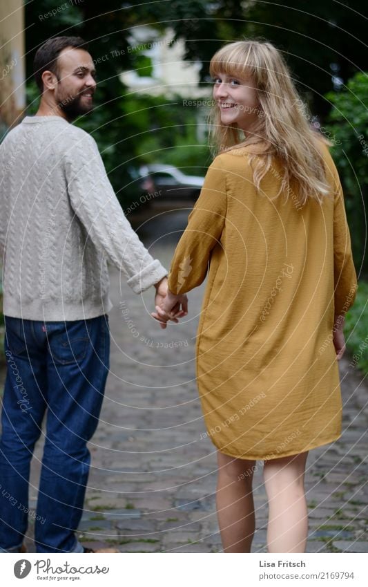 hand in hand Couple Partner Adults 2 Human being 18 - 30 years Youth (Young adults) Dress Blonde Long-haired Bangs To enjoy Smiling Walking Esthetic Brash