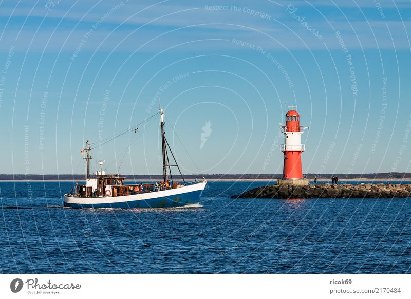 A fishing boat at the jetty of Warnemünde Relaxation Vacation & Travel Tourism Ocean Nature Landscape Water Clouds Rock Coast Baltic Sea Fishing boat Watercraft
