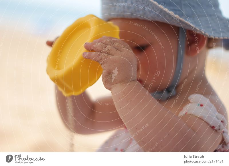 The sand is running Baby Toddler Infancy 1 Human being 1 - 3 years Sand Summer Beautiful weather Warmth Beach Hat To hold on Looking Curiosity Cute Blue Yellow