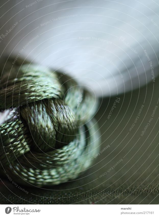 knotted Handicraft Green Soft Abstract Knot Dark Decoration Close-up Detail Colour photo Interior shot Blur Shallow depth of field Glittering Rope Deserted