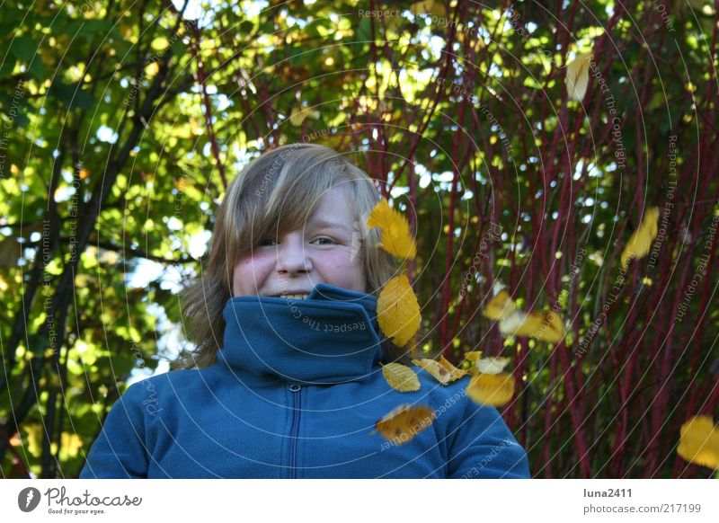 leaf rain Garden Autumn Bushes Leaf Sweater Blonde Bangs To enjoy Happiness Multicoloured Exterior shot Light Shadow Upper body Looking into the camera