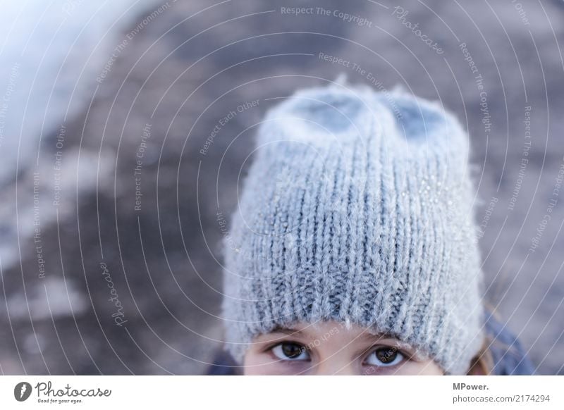 little spy Human being Girl 1 8 - 13 years Child Infancy Looking Observe Eyes Cap Winter Looking into the camera Hide Woolen hat Cold Spy Informer Exterior shot