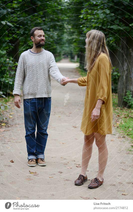 Holding hands - young couple Couple Partner Adults Life 2 Human being 18 - 30 years Youth (Young adults) tree Park Dress Facial hair Touch Communicate smile