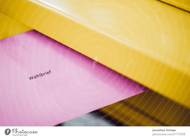 Postal voting for Bundestag elections, state elections, European elections - Postal voting letter at the letterbox Mailbox Reichstag Select Yellow Pink Resolve