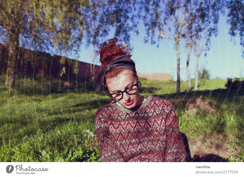 Young and redhead bored student Lifestyle Human being Feminine Young woman Youth (Young adults) 1 18 - 30 years Adults Environment Nature Grass Park Sweater