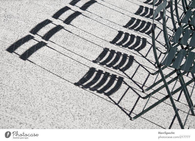 Shady places still available Chair Concrete Metal Gray Green Folding chair Shadow play Colour photo Subdued colour Exterior shot Pattern Structures and shapes