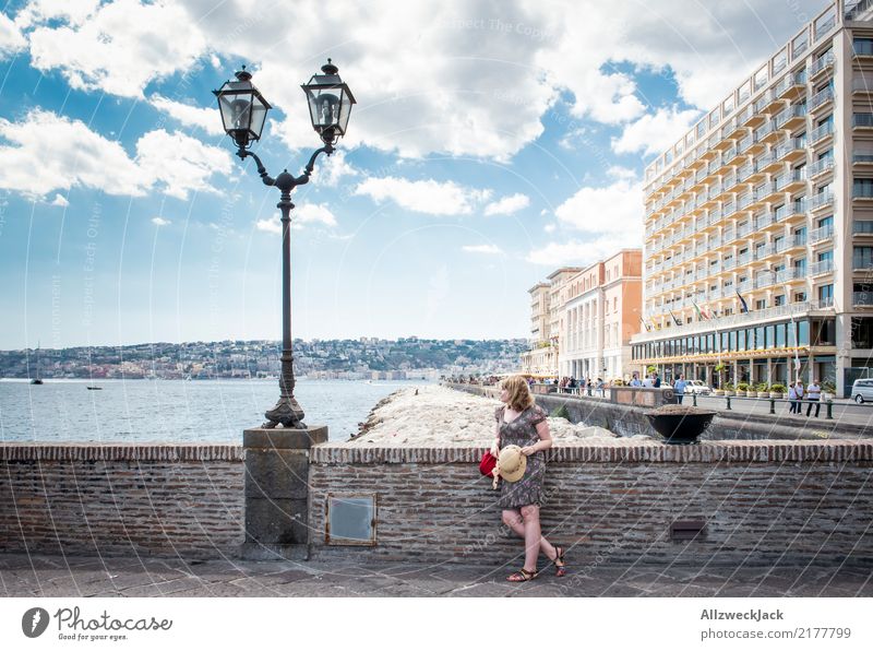 Woman stands at the promenade in Naples and looks at the sea Day Sky Clouds Italy Promenade Ocean Vacation & Travel Travel photography Town