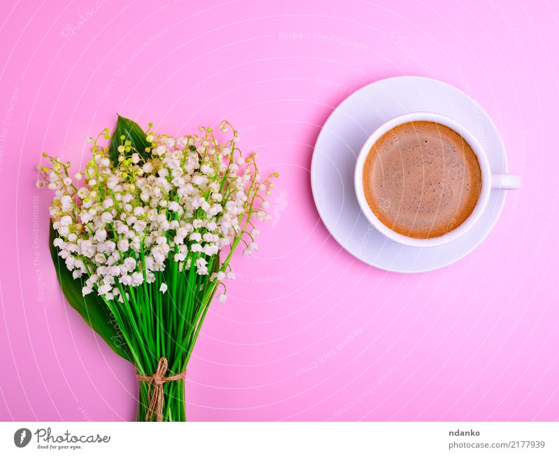 cup of black coffee Breakfast To have a coffee Hot drink Coffee Cup Mug Flower Bouquet Green Black White Lily of the valley Top stem Saucer Porcelain blooming