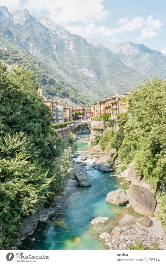 Small village on the river with bridge in the mountains Village River Summer Mountain Green Turquoise Exterior shot Primordial naturally Bridge Arched bridge
