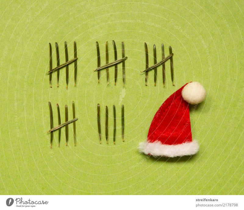 Anticipation - Santa's cap accompanied by 24 fir needles imitating an Advent calendar Winter Feasts & Celebrations Christmas & Advent Santa Claus hat