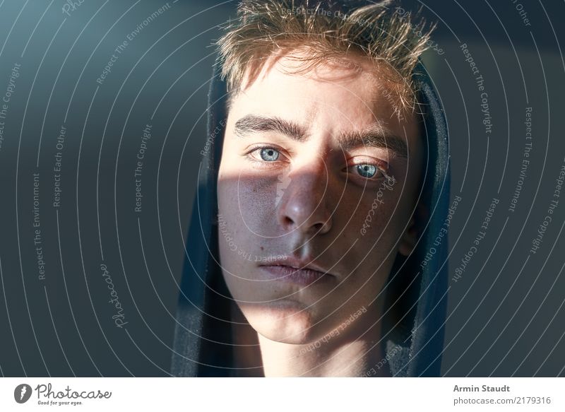 Portrait of a teenager with hoodie and sun stripes on his face Lifestyle Style already Emotions Serene Face Calm Human being Masculine Young man