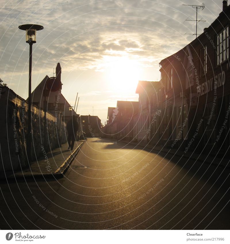 On a lonely road towards sunset Denmark Village Small Town Building Contentment Loneliness Street Old town Sky Shadow play Colour photo Exterior shot Evening