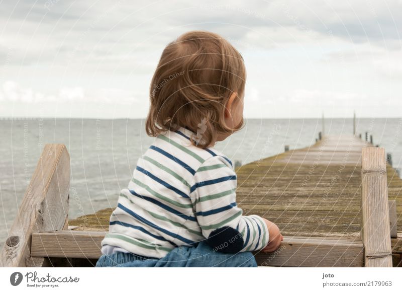 Child sitting by the sea with a view of a jetty Vacation & Travel Trip Adventure Far-off places Freedom Summer Summer vacation Ocean Toddler Infancy 1 - 3 years