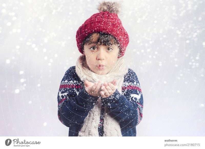 child blowing snow on christmas Lifestyle Joy Winter Snow Winter vacation Event Feasts & Celebrations Christmas & Advent New Year's Eve Human being Child
