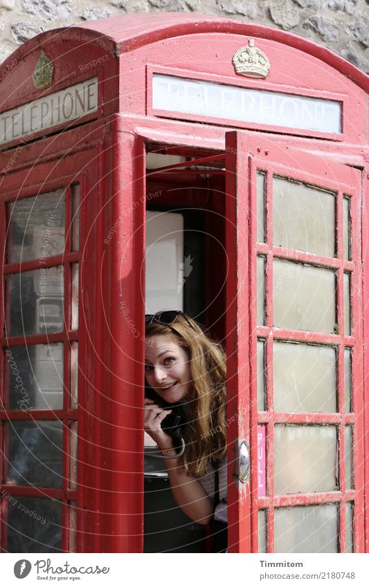 PULL - Smile from English phone booth Vacation & Travel Telephone Human being Young woman Youth (Young adults) 1 Great Britain Phone box Metal Looking Red Joy