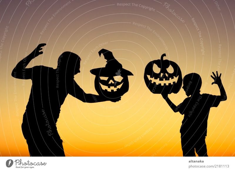Happy father and son playing outdoors Lifestyle Joy Playing Vacation & Travel Summer Feasts & Celebrations Hallowe'en Child Boy (child) Man Adults Parents