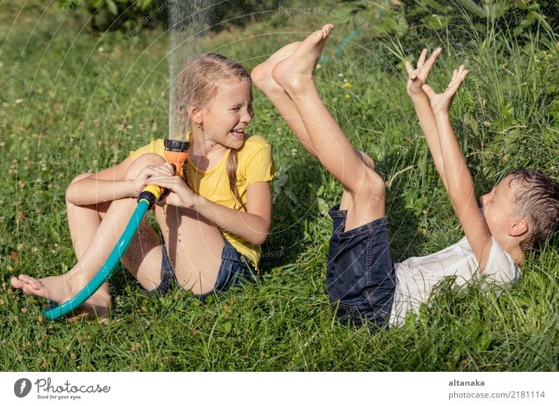 Happy kids sitting on the grass Joy Leisure and hobbies Playing Vacation & Travel Freedom Summer House (Residential Structure) Garden Child Boy (child)