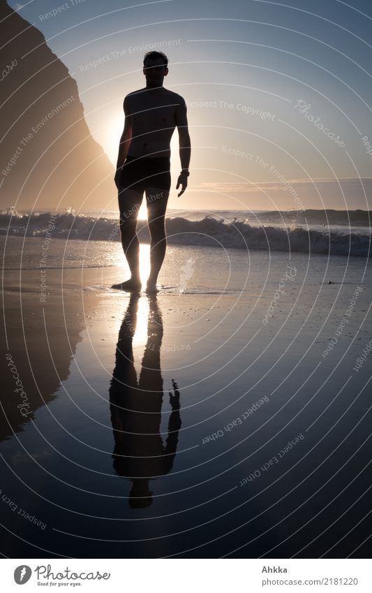 Young man reflected on the beach in the waves Life Well-being Senses Relaxation Calm Adventure Summer vacation Sun Beach Ocean Waves Sports Swimming & Bathing