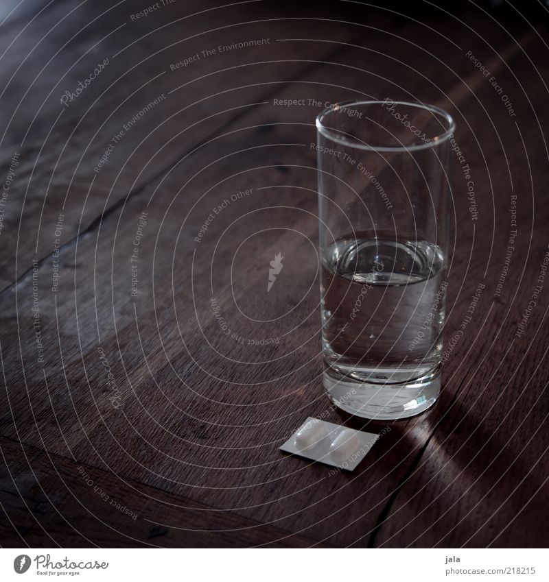 pain, let go! Beverage Drinking water Glass Table Wood Pain Pill Water Colour photo Subdued colour Interior shot Deserted Copy Space left Copy Space top