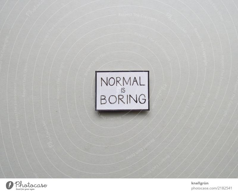 NORMAL IS BORING Characters Signs and labeling Communicate Sharp-edged Gray Black White Emotions Boredom Colour photo Studio shot Deserted Copy Space left