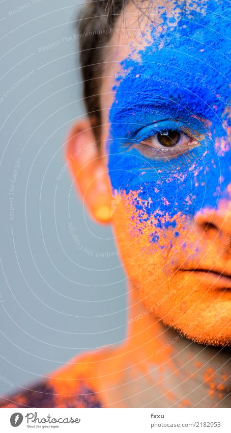 Young man with color on his face Youth (Young adults) Boy (child) Man CinemaPowderColorDyeDyeFace orangeblueShadowscaryFests & Feasts & Celebrations The