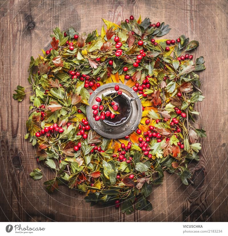 Wreath of autumn leaves and berries and cup of tea Food Beverage Hot drink Tea Cup Style Design Living or residing Table Thanksgiving Autumn Warmth Yellow
