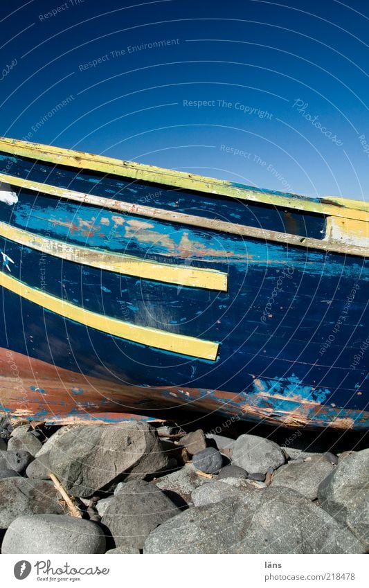 wreck Sky Cloudless sky Beautiful weather Coast Navigation Fishing boat Stone Wood Old Authentic Blue Yellow Decline Change Varnish Paintwork Broken Stranded