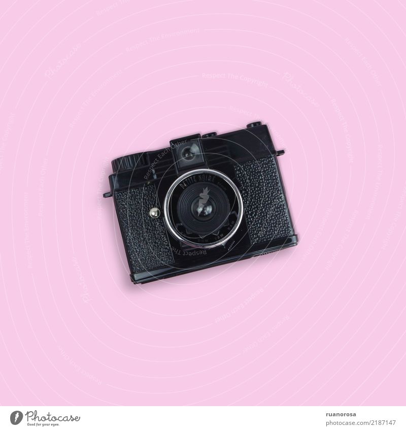 Old camera isolated on pink background. photo stillife pinky Colour photo Looking old analog vintage centered Retro Photography Old fashioned obsolete Camera