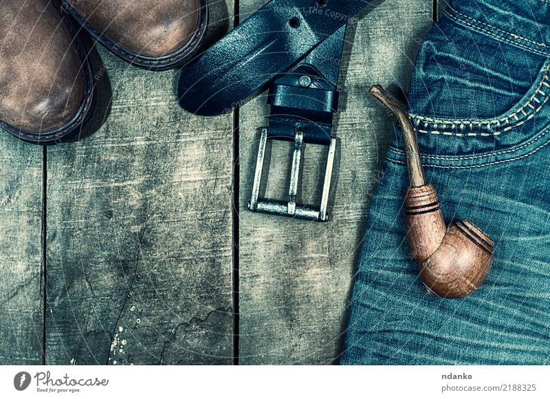 worn blue jeans and brown shoes Style Design Fashion Clothing Jeans Leather Footwear Boots Wood Old Hip & trendy Above Retro Blue Brown Black pocket pipe Denim
